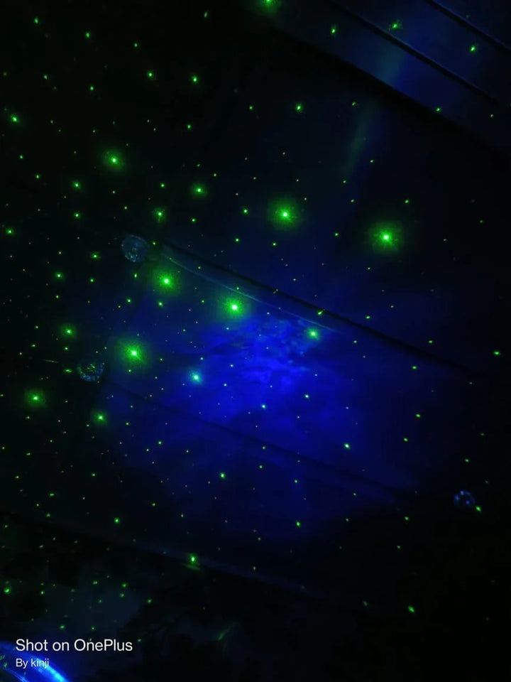 Dark surface with green laser lights creating a starry effect