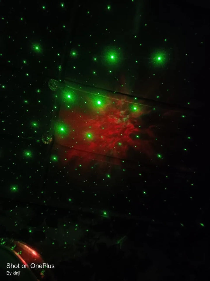 Green laser lights on a dark background