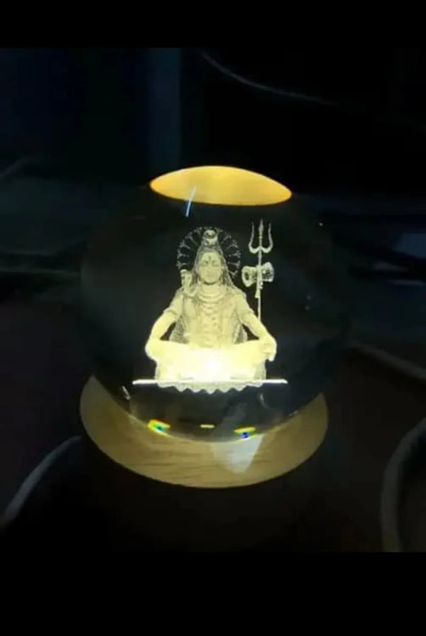 Vaayu‑E‑Store Shiva crystal ball night lamp on wooden LED base

Laser-engraved Lord Shiva inside crystal sphere

USB-powered touch LED base for spiritual night light