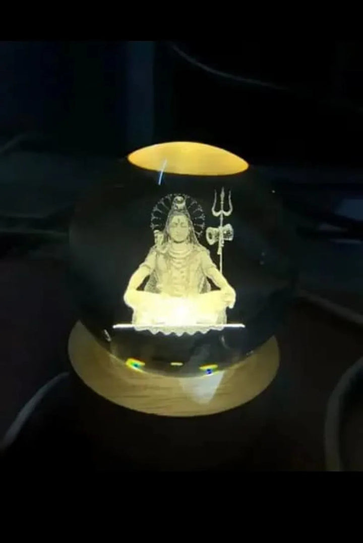 Vaayu‑E‑Store Shiva crystal ball night lamp on wooden LED base

Laser-engraved Lord Shiva inside crystal sphere

USB-powered touch LED base for spiritual night light